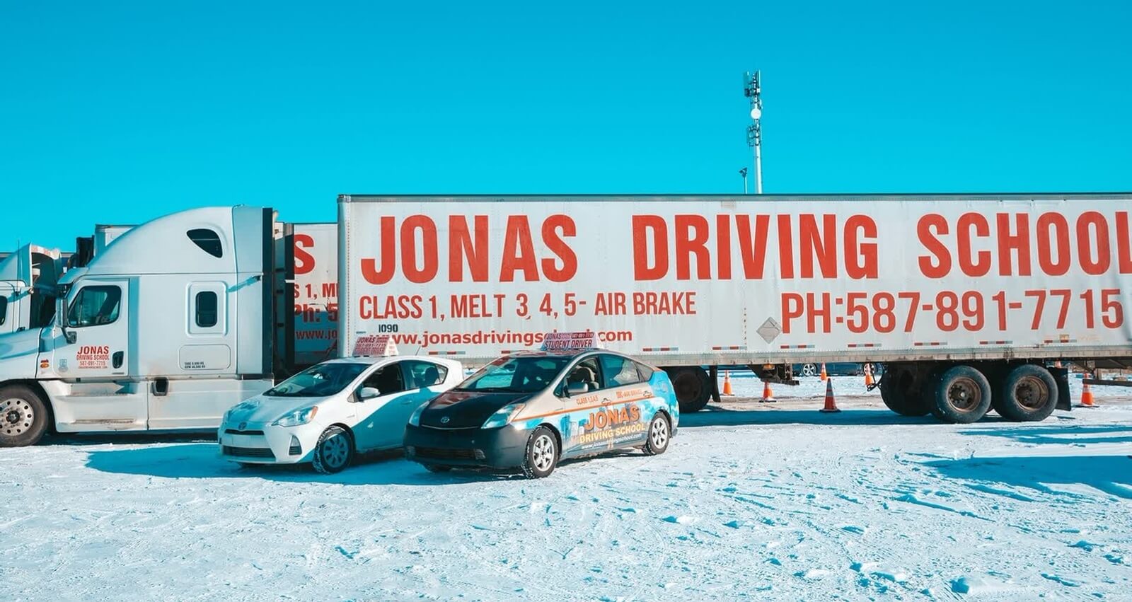 Vehicles of Jonas Driving School parked outside
