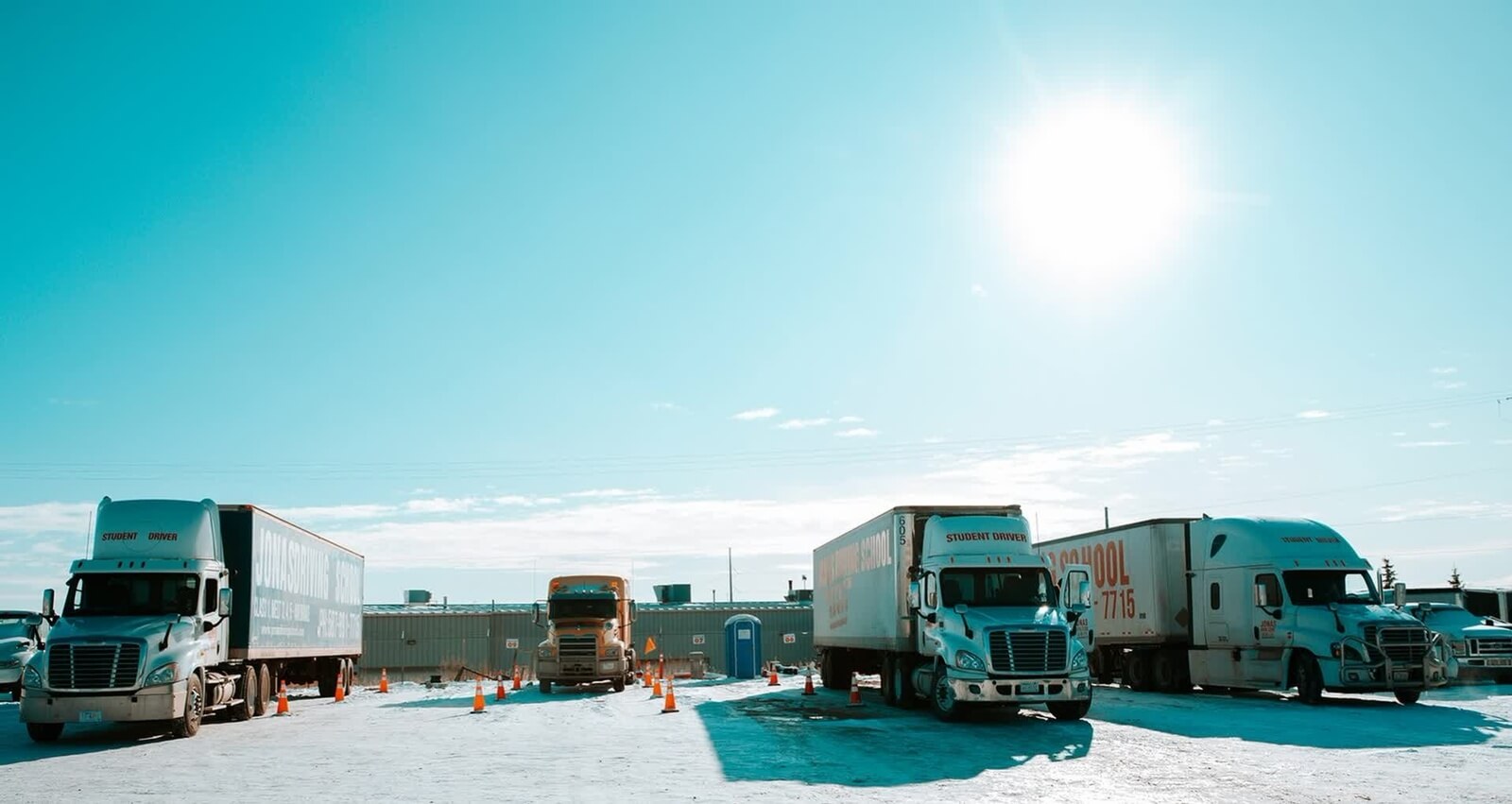 Trucks parked outside of Jonas Driving School