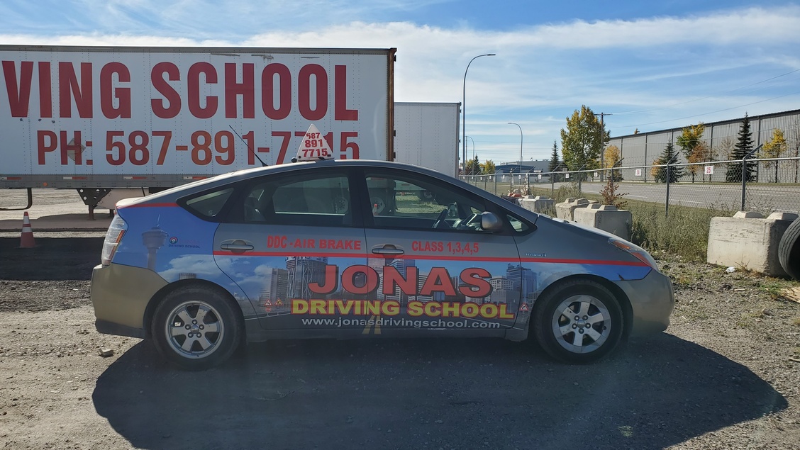 A car parked outside Jonas Driving School